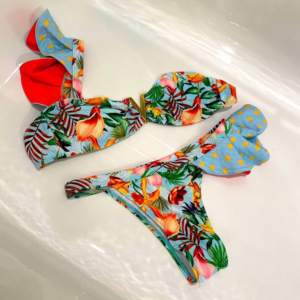Bright and tropical two-piece bikini with asymmetrical ruffle